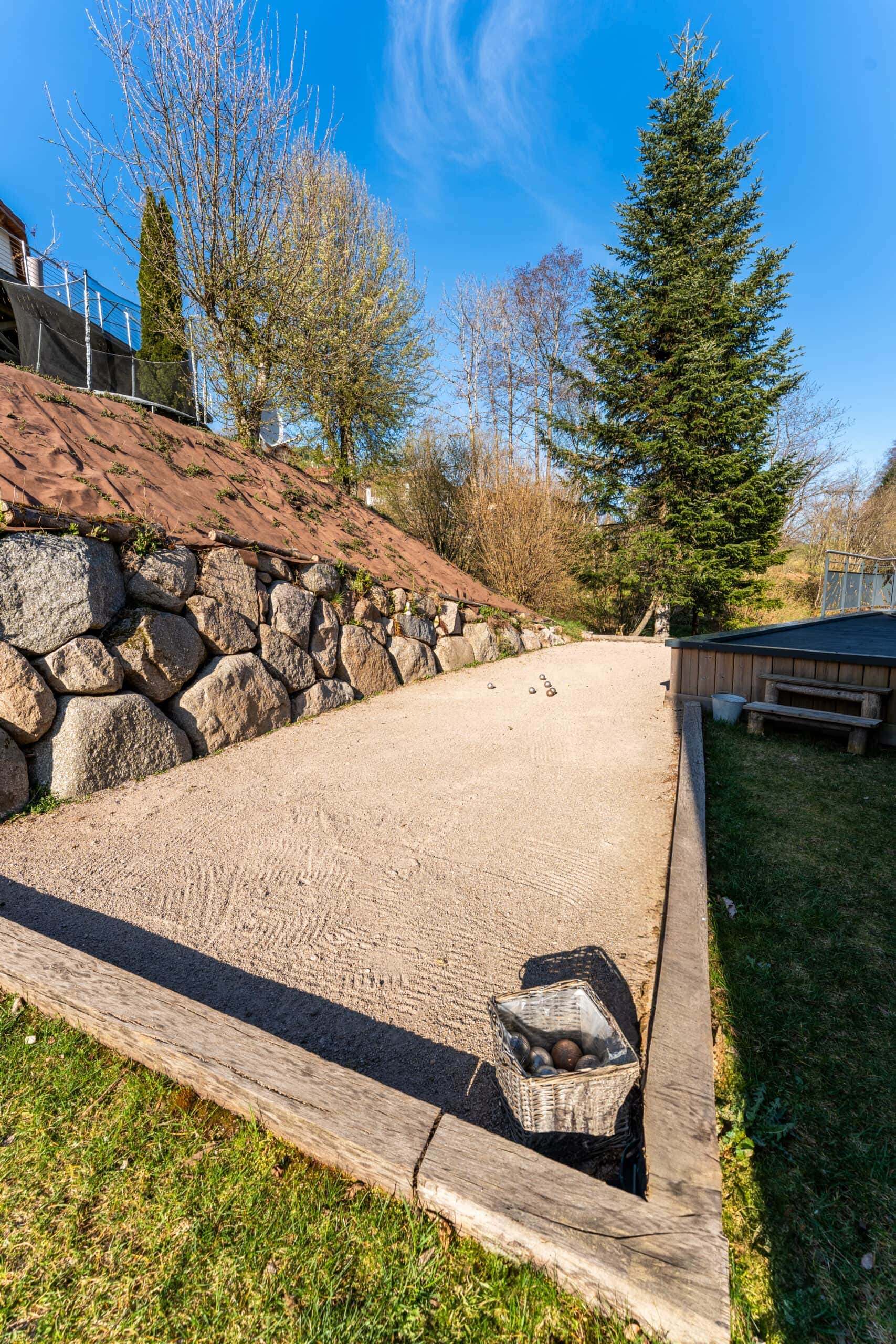 Terrain de pétanque extérieur au chalet La Bresse.